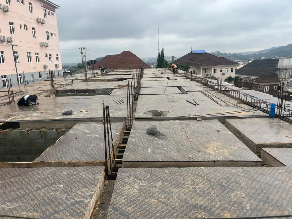 Roof slab formwork on the terrace block, with neighbouring buildings in Apo
